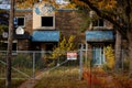 Demolition sign saying danger on the fence of houses in Hamilton, Canada