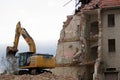 Demolition work old building with excavator