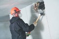 Demolition work and rearrangement. worker with sledgehammer destroying wall Royalty Free Stock Photo