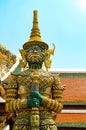 Demon guard at the entrance to the sacred Thai [Temple of the Emerald Buddha, in the capital of Thailand Bangkok