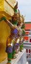 Demon supporting golden chedis, wat phra kaew, bangkok, thailand