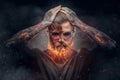 Demonic male with burning beard and arms. Royalty Free Stock Photo