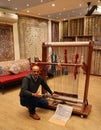 Demonstration of carpet weaving by a carpet seller.