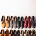 Demonstration of a collection of models of classic shoes in a row, white background. AI generated.