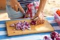 Demonstration cooking, chopping red onions Royalty Free Stock Photo