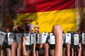 Demonstration fighting concept - protest in Spain on flag background, police officers stand against the demonstrators crowd -