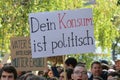 Demonstration during Global Climate Strike with sign saying `Your consumption is political` in German