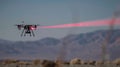 A demonstration of a laserbased counterdrone system precisely targeting and disabling a small drone from a safe distance