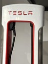 demonstration model of TESLA Superchargers to recharge battery of cars American company Elon Musk in showroom, electric vehicle