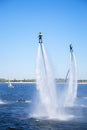 Demonstration performances of flyboard athletes. Beautiful unusual water soprt