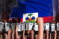 Demonstration stopping concept - protest in Haiti on flag background, police officers stand against the demonstrators crowd -