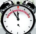 Demonstrations soon, almost there, in short time - a clock symbolizes a reminder that Demonstrations is near, will happen and