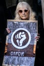 Demonstrations of Students in Serbia, elder woman came to support, holding sign with written Resistance