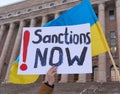 Demonstrator in a rally against RussiaÃ¢â¬â¢s military actions and occupation in Ukraine carrying sign Sanctions Now!