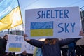 Demonstrator in a rally against RussiaÃ¢â¬â¢s military actions and occupation in Ukraine carrying sign Shelter sky