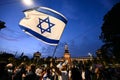 A demonstrator waves a flag of Israel during a rally in support of Israel organized by the Jewish community of Milan in central Mi