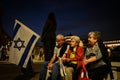 Demonstrators hold Israeli national flags to during a rally in support of Israel organized by the Jewish community of Milan in cen
