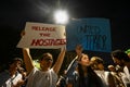 Demonstrators hold placards during a rally in support of Israel