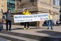 Demonstrators hold a sign saying 'Make Monarchy History' ahead of the King's Coronation in the UK.