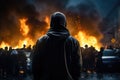 Demonstrators protest in the center of Mulhouse, Back view Aggressive man without face in hood against backdrop of protests and