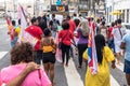 Demonstrators walk with posters, banners and flags during the Crespo Empowerment March in Salvador, Bahia