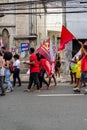 Demonstrators walk with posters, banners and flags during the Crespo Empowerment March in Salvador, Bahia