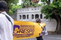 Demonstrators walk with posters, banners and flags during the Crespo Empowerment March in Salvador, Bahia