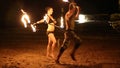 Demonstrators who fire dancing on the sand.