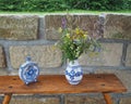 Demotic white blue painted pottery flask and vase with field fl