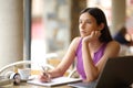 Demotivated student looking away in a restaurant Royalty Free Stock Photo