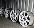 Set Of Dismantled Damaged Wheel Rims In Garage