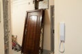 Demounted door is in hall, doorframe is ready for new one, home renovation Royalty Free Stock Photo