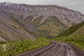 Dempster Highway winding down into mountains