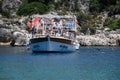 Tourists swim in the sea near a pleasure yacht. The Mediterranean Sea off the coast of Kekova and Demre