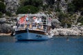 Tourists swim in the sea near a pleasure yacht. The Mediterranean Sea off the coast of Kekova and Demre