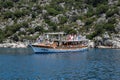 Tourists swim in the sea near a pleasure yacht. The Mediterranean Sea off the coast of Kekova and Demre