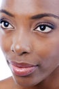 Demure Beauty. Closeup studio shot of a young beautiful african american model isolated on white.