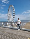 Den Haag Scheveningen boulevard during spring with people by the ferry wheel boulevard Royalty Free Stock Photo