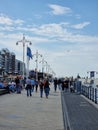 Den Haag Scheveningen boulevard during spring with people by the ferry wheel boulevard Royalty Free Stock Photo