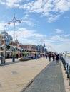 Den Haag Scheveningen boulevard during spring with people by the ferry wheel boulevard Royalty Free Stock Photo