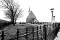 Den Hoorn, The Netherlands - February 25, 2010: Autumn foggy morning, cemetery in front of the church of Den Hoorn on Texel island Royalty Free Stock Photo