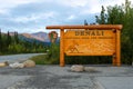 Denali National Park sign at entrance with tree and beautiful mountain in the background Royalty Free Stock Photo