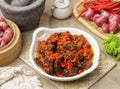 Dendeng balado on a white plate with spices Royalty Free Stock Photo