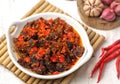 Dendeng balado on white plate with white background Royalty Free Stock Photo