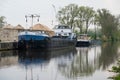 Dendermonde, East Flanders, Belgium - Industrial cargo ship Rapido at the banks of the River Dender