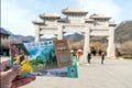 Dengfeng,Henan,China - December 29, 2019: Asian holding entrance ticket at Shaolin Temple white front gate the famous place in