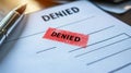 Denied Stamp On Document With A Pen. Symbolizes Rejection, Refusal, Or Negative Decision On An Application Royalty Free Stock Photo