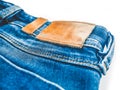 Denim background. Blue jeans with a brown leather label empty space Royalty Free Stock Photo