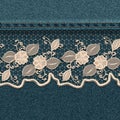 Denim background with white lace ribbon.