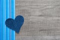 Denim blue heart on wooden background